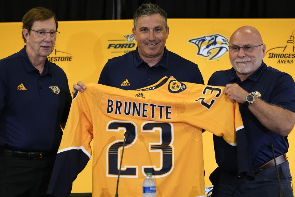 Nashville Predators founding general manager David Poile, left, new head coach Andrew Brunette and incoming general manager Barry Trotz pose for a picture during a news conference at the NHL hockey team's arena, Wednesday, May 31, 2023, in Nashville, Tenn. (AP Photo/George Walker IV)