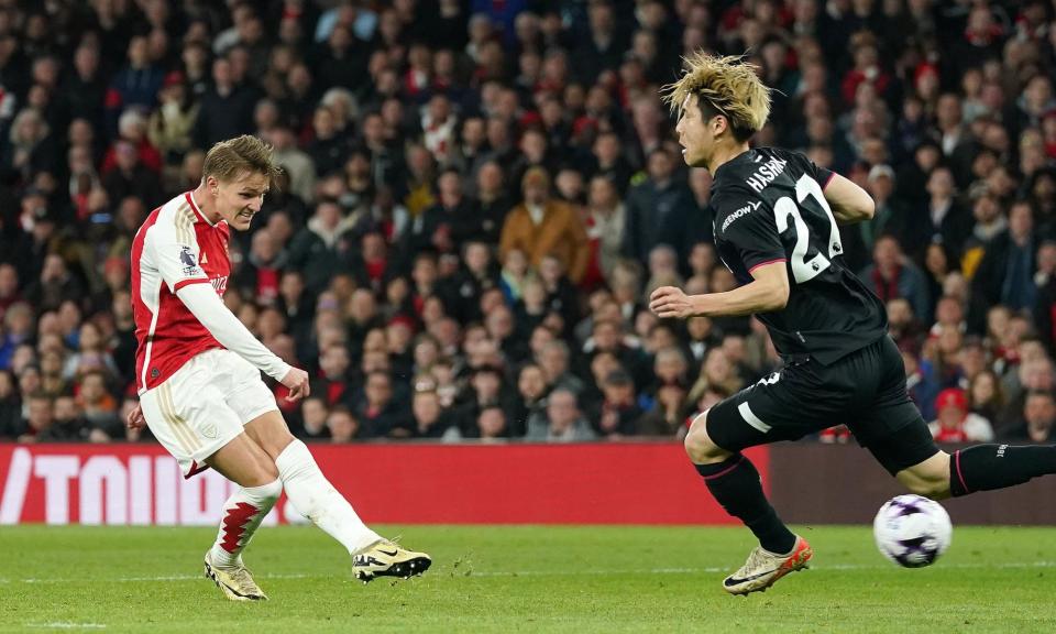 <span>Martin Ødegaard drills Arsenal into the lead against Luton in the first half.</span><span>Photograph: Nick Potts/PA</span>