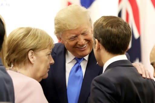 US President Donald Trump was all smiles with Germany's Chancellor Angela Merkel and France's President Emmanuel Macron at a June meeting in Japan