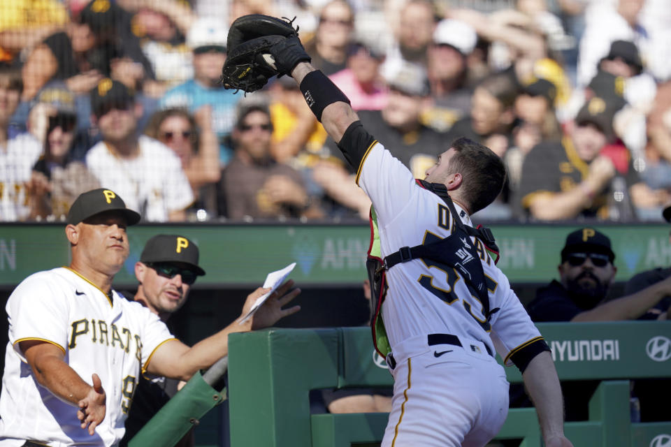 Pittsburgh Pirates catcher Jason Delay pulls in a foul ball hit by Miami Marlins' Nick Fortes during the third inning of a baseball game in Pittsburgh, Sunday, Oct. 1, 2023. (AP Photo/Matt Freed)