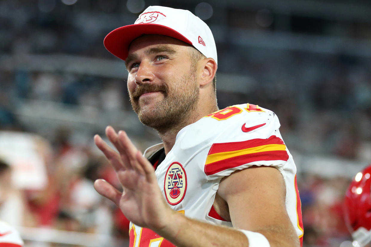 JACKSONVILLE, FLORIDA - AUGUST 10: Travis Kelce #87 of the Kansas City Chiefs waves at fans as he leaves the field at halftime during a preseason game against the Jacksonville Jaguars at EverBank Stadium on August 10, 2024 in Jacksonville, Florida. (Photo by Courtney Culbreath/Getty Images)