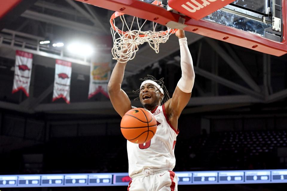 Arkansas guard Stanley Umude dunks on a fast break against Central Arkansas during the first half of an NCAA college basketball game Wednesday, Dec. 1, 2021, in Fayetteville, Ark. (AP Photo/Michael Woods)