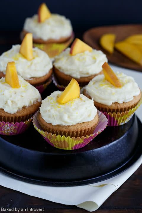 <p>Both the cake and the buttercream yield a lovely mango flavor in these fruity cupcakes.</p><p><strong><a href="http://www.bakedbyanintrovert.com/mango-cupcakes-mango-buttercream-recipe/#_a5y_p=5121226" rel="nofollow noopener" target="_blank" data-ylk="slk:Get the recipe at Baked by an Introvert.;elm:context_link;itc:0;sec:content-canvas" class="link ">Get the recipe at Baked by an Introvert.</a></strong></p>