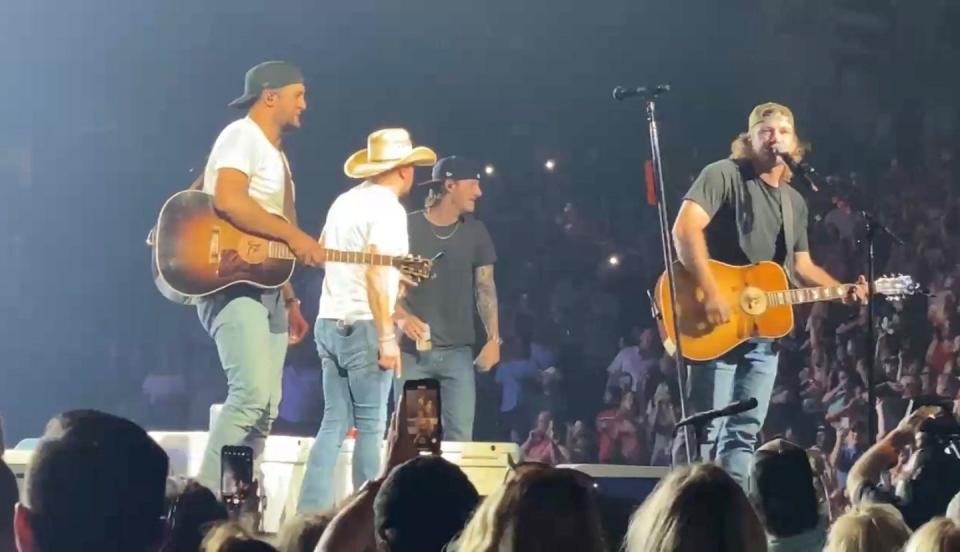 Morgan Wallen made a surprise appearance at Luke Bryan's July 30 concert at Nashville's Bridgestone Arena.