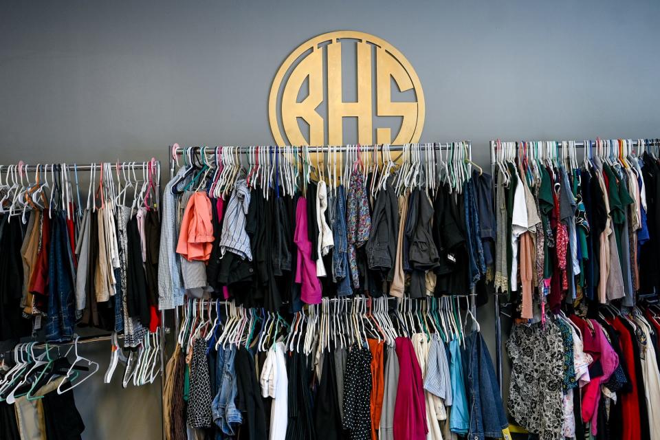 Clothing for all ages hangs on racks for community members at The Bread House South on Friday, Aug. 12, 2022, in Lansing.