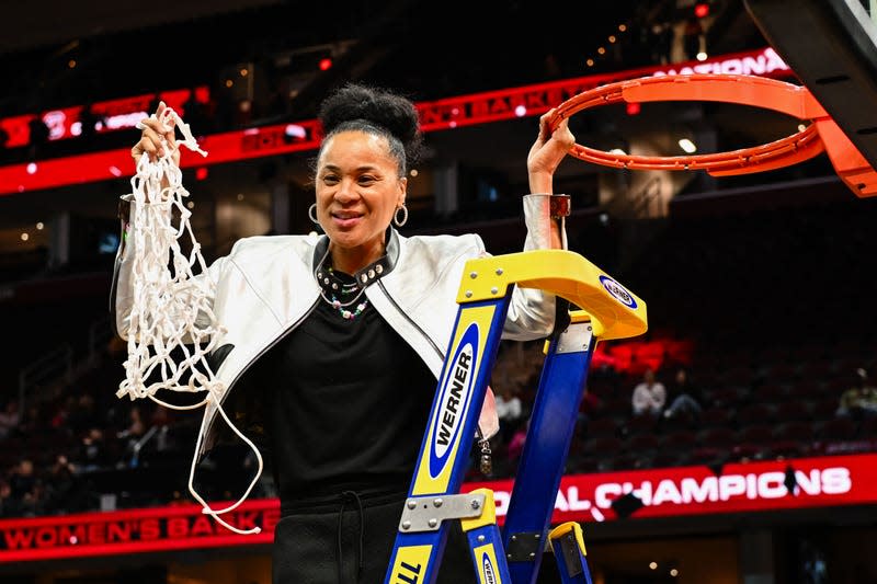 CLEVELAND, OH - APRIL 7: Head coach Dawn Staley of the South Carolina Gamecocks cuts down the net after defeating the Iowa Hawkeyes 87-75 at the 2024 NCAA Women’s Basketball Tournament championship game between Iowa and South Carolina at Rocket Mortgage FieldHouse on April 7, 2024 in Cleveland, Ohio. - Photo: Thien-An Truong (Getty Images)