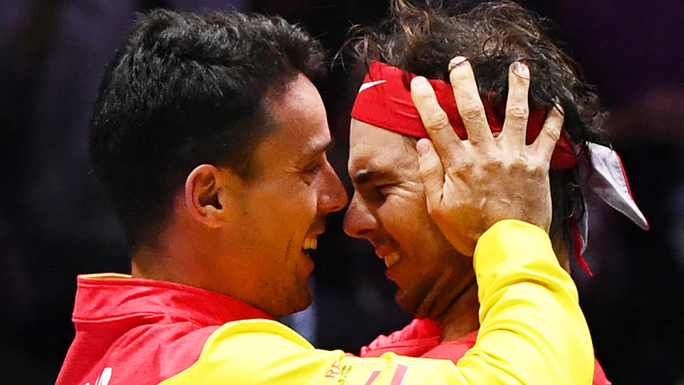 Spain's Roberto Bautista Agut and Rafael Nadal embrace after winning the 2019 Davis Cup. (Photo by GABRIEL BOUYS/AFP via Getty Images)