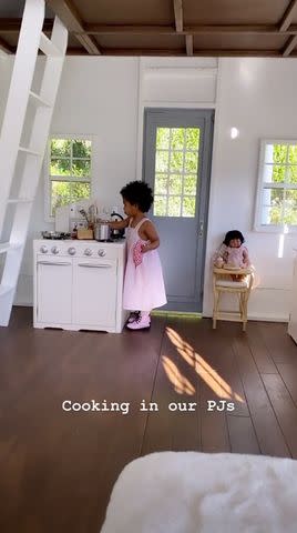 Toddler True Thompson cooks in her playhouse kitchen