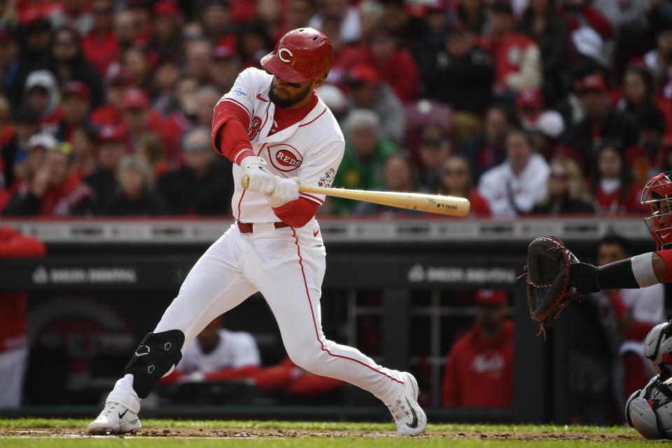 Cincinnati Reds' Nick Martini (23) takes a swing during the second inning of an opening day baseball game against the Washington Nationals in Cincinnati, Thursday, March 28, 2024. (AP Photo/Timothy D. Easley)