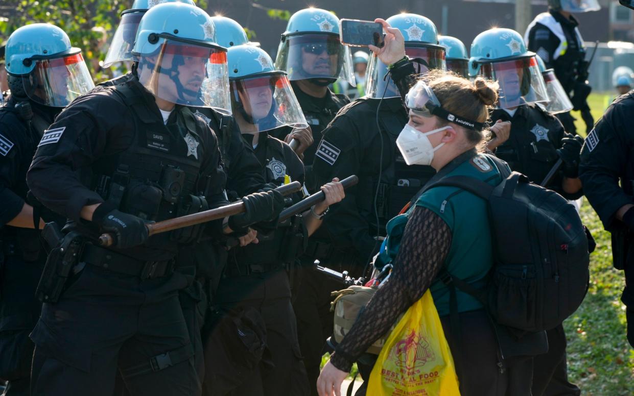 A protester with police during the demonstration