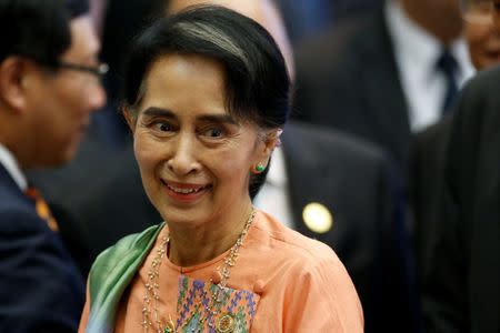 Myanmar's State Counsellor Aung San Suu Kyi arrives at the ASEAN-India Summit in Vientiane, Laos September 8, 2016. REUTERS/Soe Zeya Tun/File Photo