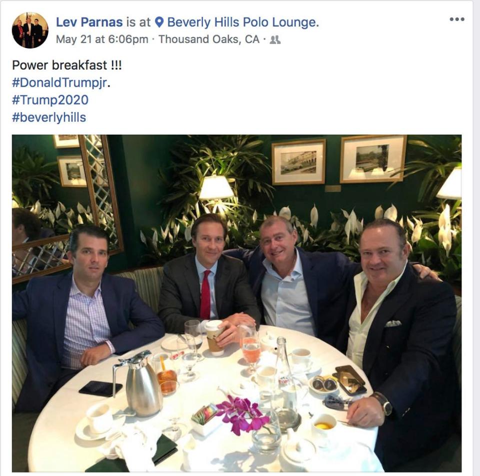 This Facebook screen shot provided by The Campaign Legal Center, shows from left, Donald Trump, Jr., Tommy Hicks, Jr., Lev Parnas and Igor Fruman, posted on May 21, 2018.