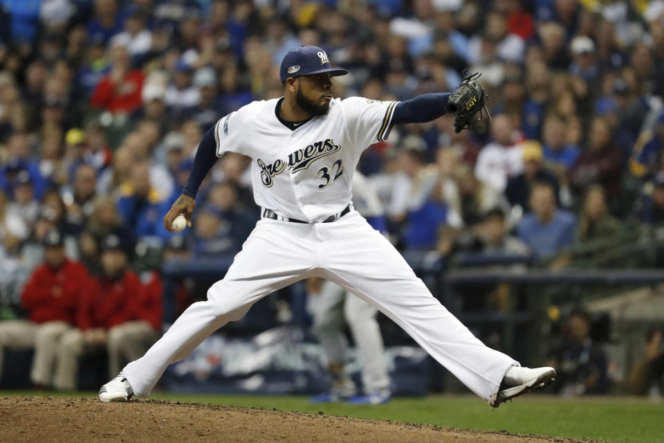 Milwaukee Brewers relief pitcher Jeremy Jeffress (32) throws during the sixth inning of Game 7 of the National League Championship Series baseball game against the Los Angeles Dodgers Saturday, Oct. 20, 2018, in Milwaukee. (AP Photo/Jeff Roberson)