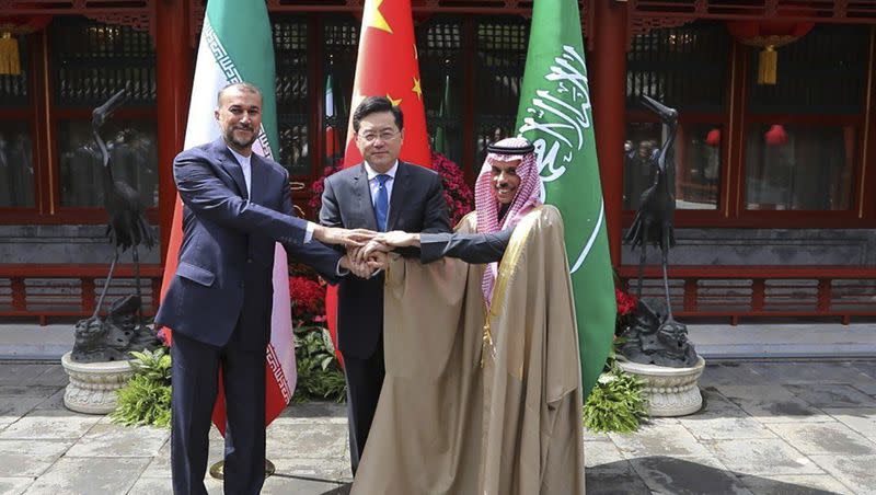 In this picture released by the Iranian Foreign Ministry, Iran’s Foreign Minister Hossein Amirabdollahian, left, shakes hands with his Saudi Arabian counterpart Prince Faisal bin Farhan Al Saud, right, and Chinese counterpart Qin Gang in Beijing Thursday, April 6, 2023.