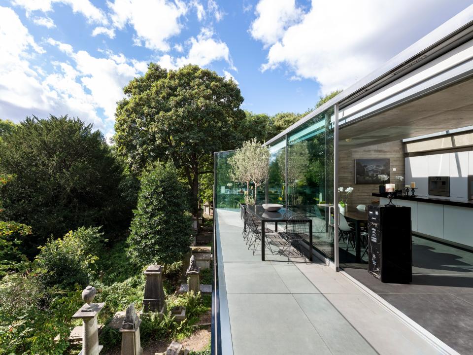 A balcony provides sweeping views of the cemetery.