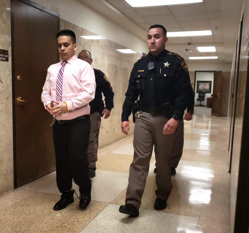 Rico Martinez, left, is escorted out of the 140th District Court room after he was sentenced to 40-years in prison for choking a 6-month-old girl with a pacifier in 2018.