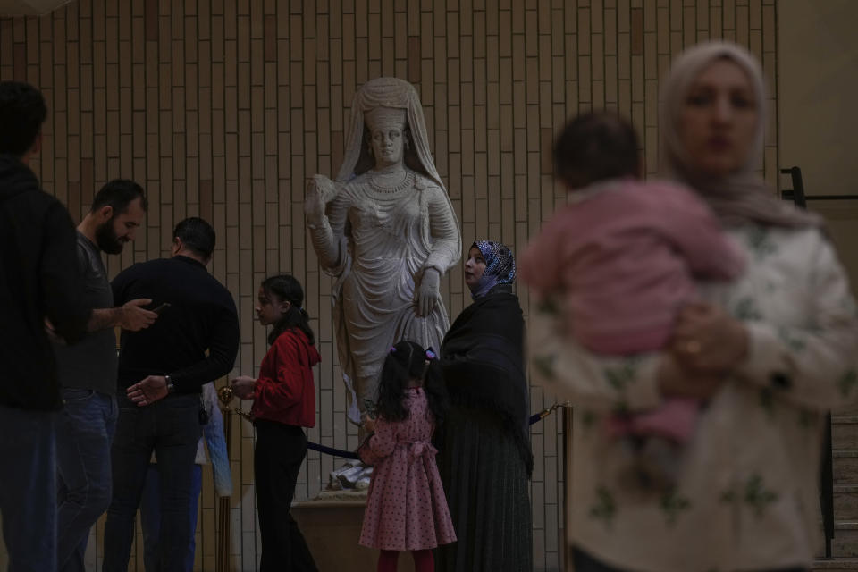 People visit the Iraqi National Museum in Baghdad, Iraq, Friday, Feb. 24, 2023, which reopened to the public after months or maintenance work. Iraq's national museum was looted and vandalized by a frenzied mob during the U.S.-led invasion in April 2003 to topple Saddam Hussein. (AP Photo/Hadi Mizban)