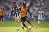 Britain Soccer Football - Hull City v Sheffield Wednesday - Sky Bet Football League Championship Play-Off Final - Wembley Stadium - 28/5/16 Hull City's Moses Odubajo in action with Sheffield Wednesday's Kieran Lee Action Images via Reuters / Tony O'Brien Livepic EDITORIAL USE ONLY. No use with unauthorized audio, video, data, fixture lists, club/league logos or "live" services. Online in-match use limited to 45 images, no video emulation. No use in betting, games or single club/league/player publications. Please contact your account representative for further details.