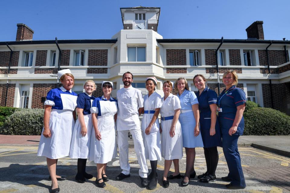 Nurses in uniforms to represent each decade of the NHS pose outside Trafford Hospital to celebrate the 70th birthday of the NHS at Trafford Hospital, birthplace of the NHS: Getty Images