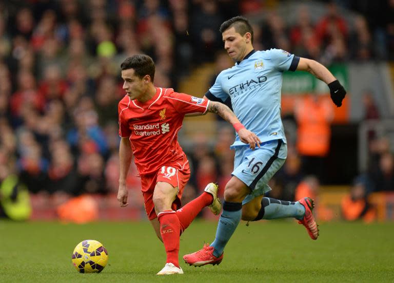 Manchester City's Sergio Aguero (R) and Liverpool's Philippe Coutinho during their Premier League match at Anfield on March 1, 2015