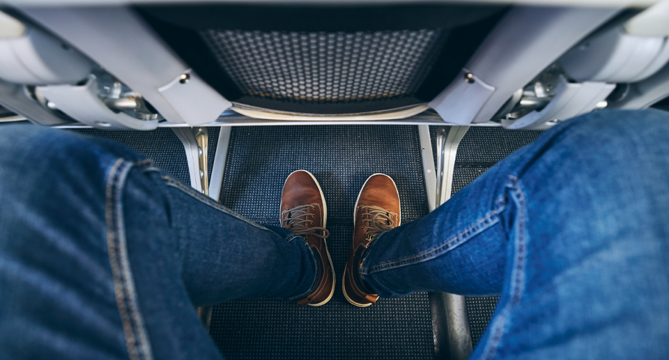 A view of the floor of a plane cabin. 