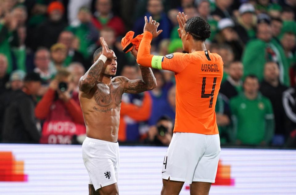 Netherlands’ Memphis Depay (left) celebrates scoring his side’s third goal of the game with Virgil van Dijk during the UEFA Euro 2020 qualifying, group C match at the Stadion Feijenoord, Rotterdam. (PA Archive)