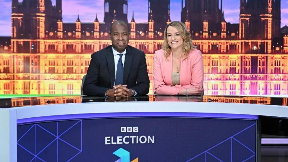 Clive Myrie and Laura Kuenssberg pictured alongside BBC election branding