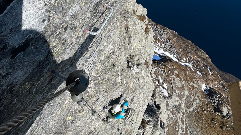 Scaling a sheer cliff is not for the faint-hearted, but the steel ladders and steps help the harnessed climbers on their way. - Norges Boltefond/Hornelen Via Ferrata/Visit Nordfjord