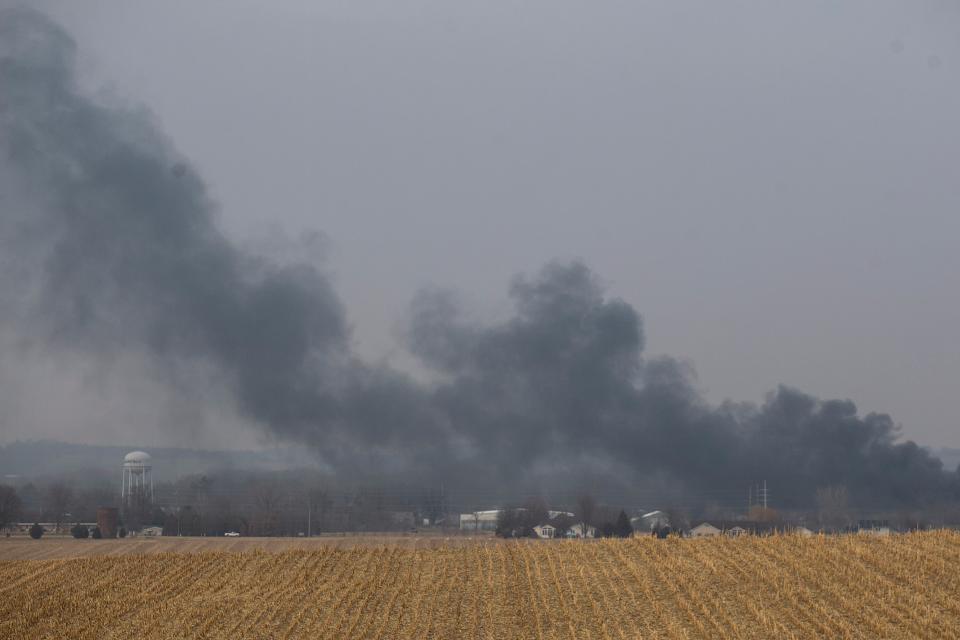 Smoke wafts over the horizon from the fire at C6-Zero on Thursday, Dec. 8, 2022, in Marengo, Iowa. The plant breaks down asphalt shingles into fiberglass, gravel and oil.