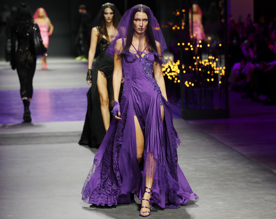 <p>Bella Hadid gives high-fashion bride vibes during her walk in the Versace show at Milan Fashion Week in Italy on Sept. 23. </p>