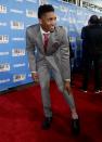 <p>Louisville’s Donovan Mitchell shows off his socks while stopping for photos on the red carpet before the start of the NBA basketball draft, Thursday, June 22, 2017, in New York. (AP Photo/Frank Franklin II) </p>