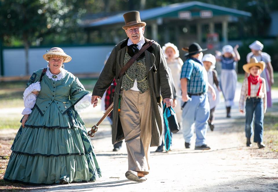 Mary Lee Sweet, left, and her husband, Frank, dressed in late 1800s attire and strolled into the Cracker Village, as hundreds of Marion County students took part in Ocali Country Days at the Silver River Museum in 2018. [Doug Engle/Ocala Star-Banner]2018