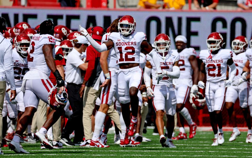 OU defensive back Key Lawrence (12) reacts after making an interception during the second half of a 49-14 win at Nebraska on Saturday.