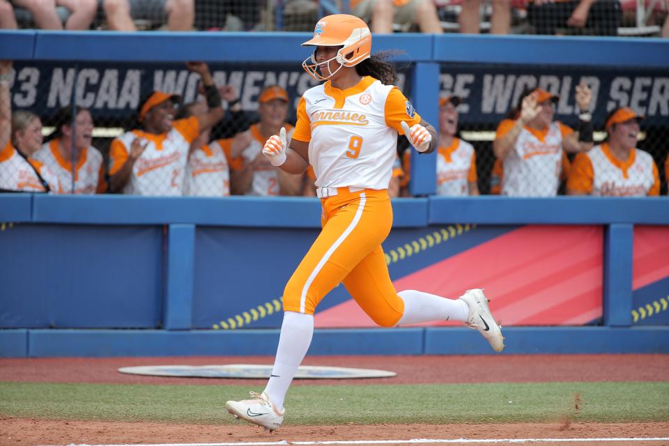 Tennessee's Kiki Milloy (9) runs home to score in the second inning of a softball game between Tennessee and Alabama in the Women's College World Series at USA Softball Hall of Fame Stadium in Oklahoma City, Thursday, June 1, 2023. Bryan Terry, The Oklahoman