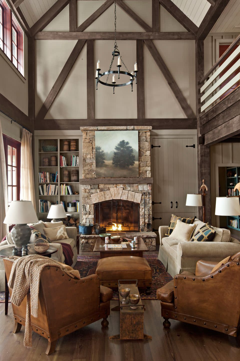 <p>In this <a href="https://www.countryliving.com/home-design/house-tours/g1381/rustic-lake-house-decorating-ideas/" rel="nofollow noopener" target="_blank" data-ylk="slk:Georgia lake house" class="link ">Georgia lake house</a>, appealingly asymmetrical built-ins—one with hidden storage, the other open—flank the great room's fieldstone fireplace. French leather club chairs from <a href="http://www.wyattchildsinc.com/" rel="nofollow noopener" target="_blank" data-ylk="slk:Wyatt Childs" class="link ">Wyatt Childs</a>, plus a pair of <a href="http://www.mgbwhome.com/" rel="nofollow noopener" target="_blank" data-ylk="slk:Mitchell Gold + Bob Williams" class="link ">Mitchell Gold + Bob Williams</a> sofas, serve up plenty of seating.</p>