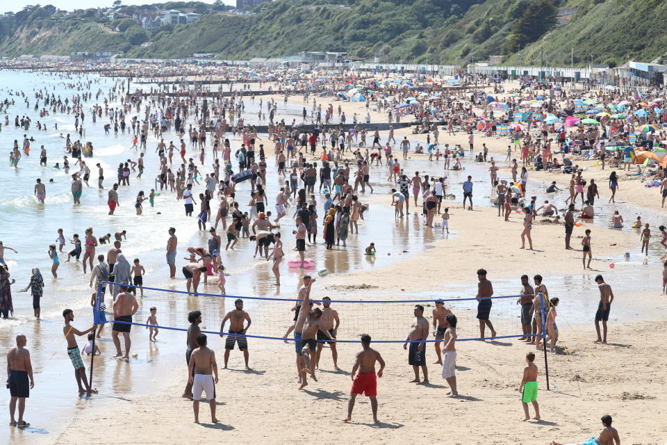 People on the beach in Bournemouth, Dorset, as the public are being reminded to practice social distancing following the relaxation of the coronavirus lockdown restrictions in England. (Photo by Andrew Matthews/PA Images via Getty Images)