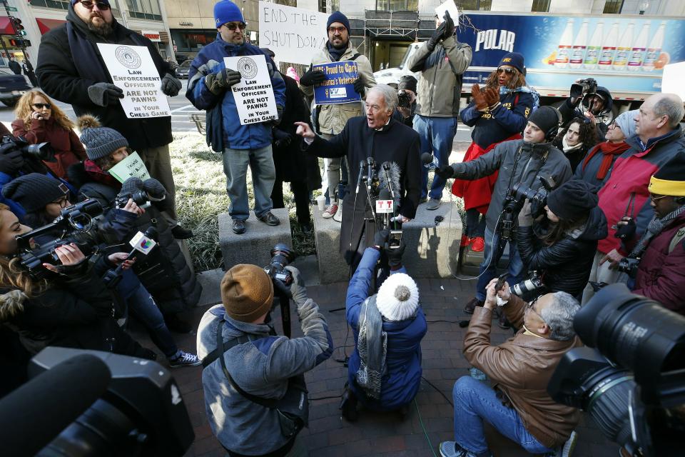 U.S. Sen. Ed Markey, D-Mass., center, speaks during a rally with government workers and their supporters in Boston, Friday, Jan.11, 2019. Markey said President Donald Trump is using federal workers and their families as "pawns" and "hostages" in a political game. (AP Photo/Michael Dwyer)