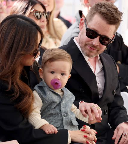 <p>Amy Sussman/Getty</p> Brenda Song and Macaulay Culkin with their son