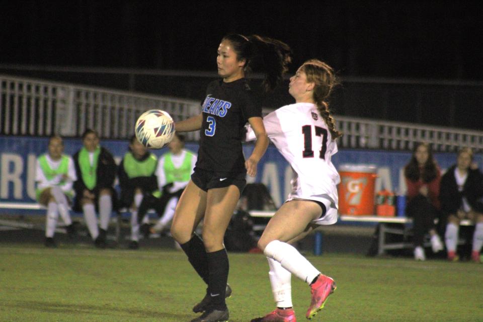 Bartram Trail midfielder Sophie Blake (3) controls the ball as Creekside midfielder Sarah Weisberg (17) challenges during a regional girls soccer playoff.