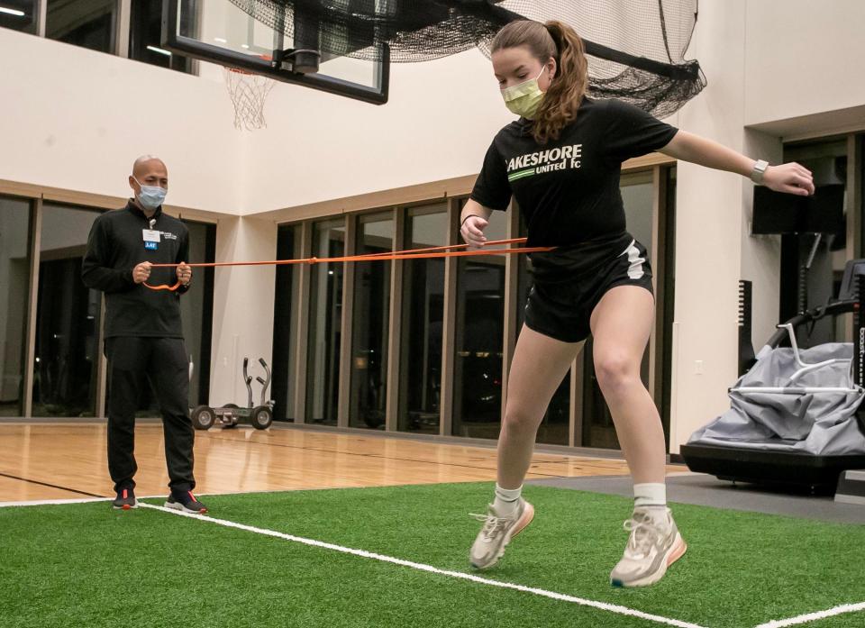 Athletic trainer Yoshi Ono, left, works with Lakeshore United soccer player Libby Cleveland, of Sheboygan, with her movement skills at Aurora Medical Center – Sheboygan County, Wednesday, January 4, 2023, at North in Sheboygan, Wis. Ono is back from being an athletic trainer at the FIFA World Cup Qatar 2022 where he helped world class athletes at the games.