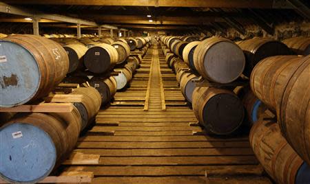 Whisky barrels are seen in the warehouse of the Diageo Cardhu distillery in Scotland March 21, 2014. REUTERS/Russell Cheyne