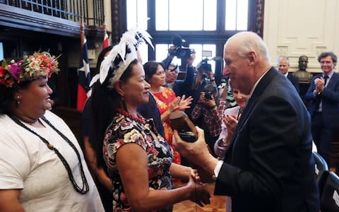 Both the explorer's son and Easter Island officials said the signing of the deal, attended by Norway's King Harald, was an emotional moment - Credit: Reuters