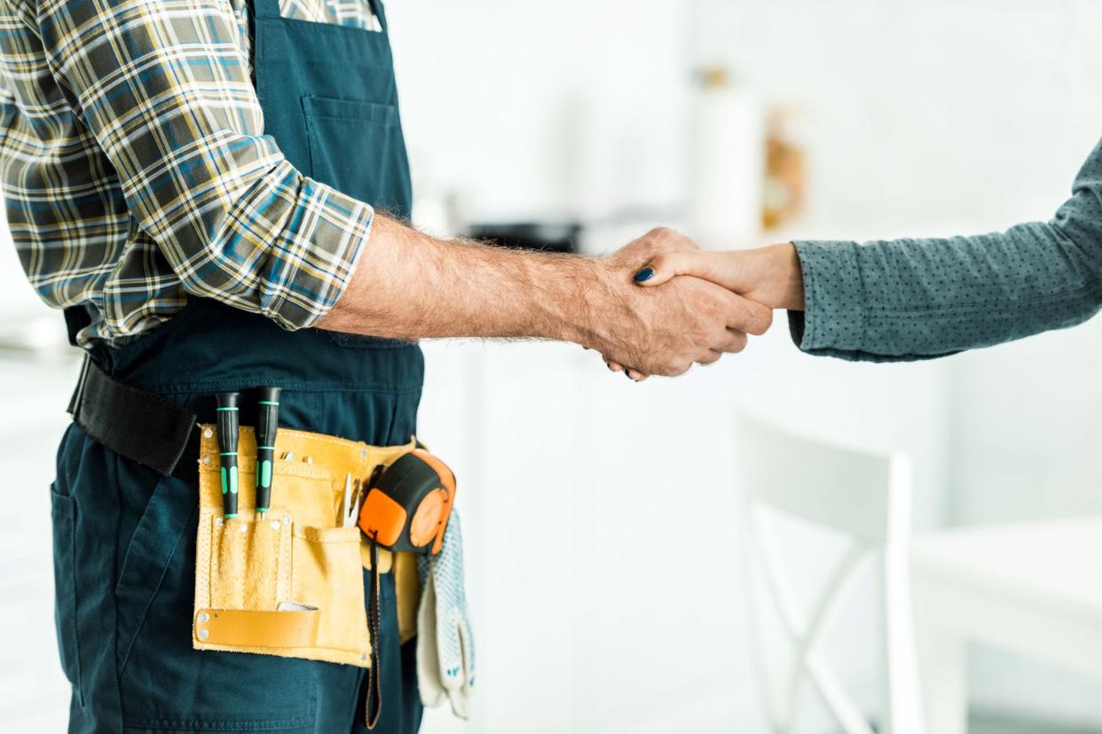 plumber shaking hands with customer