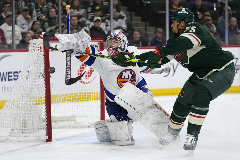 Minnesota Wild right wing Ryan Reaves shoots and scores a goal past New York Islanders goaltender Ilya Sorokin during the first period of an NHL hockey game Tuesday, Feb. 28, 2023, in St. Paul, Minn. (AP Photo/Abbie Parr)