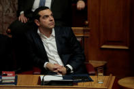 Greek Prime Minister Alexis Tsipras attends a parliamentary session before a vote on setting up a special committee which will probe the role of ten politicians in a case which involves alleged bribery by Swiss drugmaker Novartis, in Athens, Greece, February 21, 2018. REUTERS/Alkis Konstantinidis