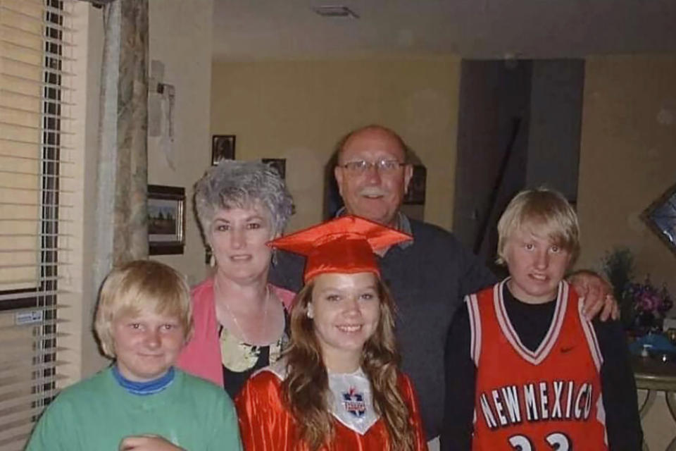 This undated photo provided by Justin Zahl, shows from left, his brother Riley, his grandmother Elizabeth Joanne Thomas, cousin Emily O’Neil, his grandfather John Zahl and him. Justin Zahl is awaiting confirmation that his grandparents are dead after their log house burned down during a rampage by a gunman disguised as a police officer in Nova Scotia that began late Saturday, April 18, 2020. He hasn’t heard from his grandparents since Saturday, and police tell him their bodies are most likely in the rubble. (Justin Zahl via AP)