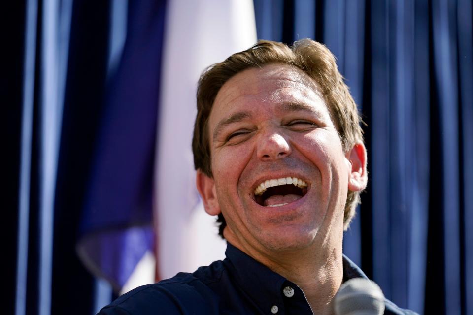 - Gov. Ron DeSantis laughs during a Fair-Side Chat with Iowa Gov. Kim Reynolds at the Iowa State Fair on Aug. 12 in Des Moines, Iowa.