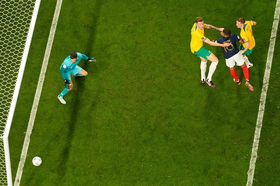 France's Kylian Mbappe, second right, scores his side's third goal during the World Cup group D football match between France and Australia, at the Al Janoub Stadium in Al Wakrah, Qatar, Tuesday, Nov. 22, 2022. (AP Photo/Pavel Golovkin)