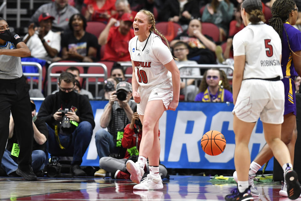 Louisville guard Hailey Van Lith (10) celebrates after scoring and getting fouled during the first half of their women's NCAA Tournament college basketball first round game against Albany in Louisville, Ky., Friday, March 18, 2022. (AP Photo/Timothy D. Easley)