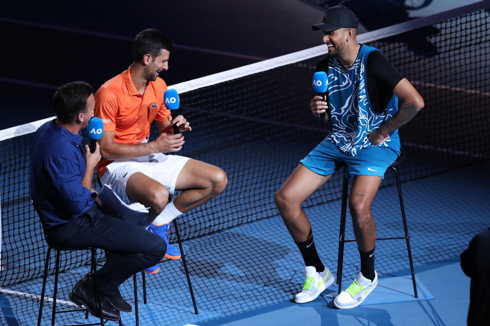 Novak Djokovic (pictured left) speaks to Nick Kyrgios (pictured right) on Rod Laver Arena.